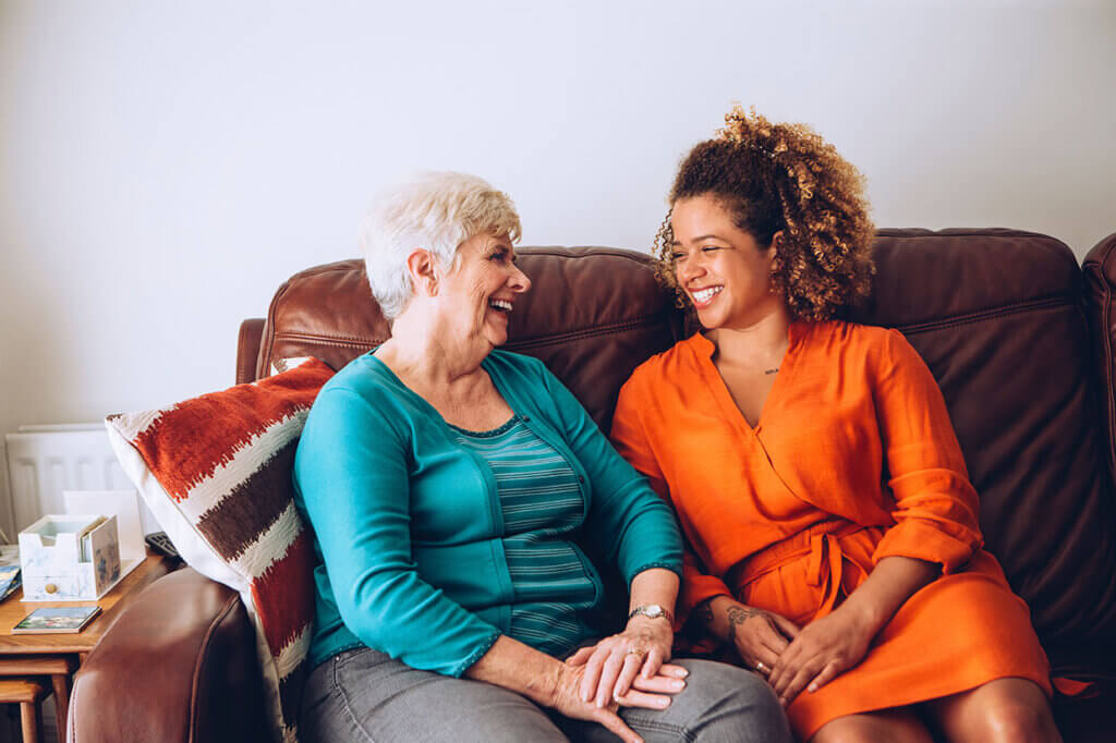 two people sitting laughing